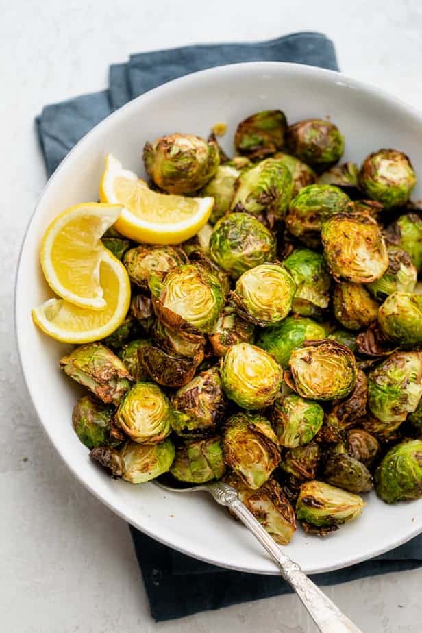Air fryer Brussel sprouts in a white bowl