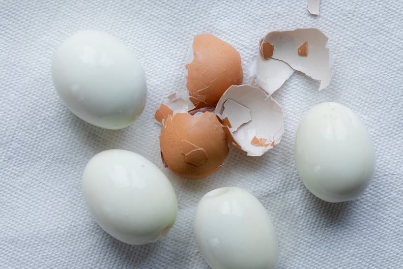 Peeling the eggs after they're cooked