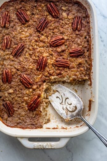 Slice cut from baked steel cut oatmeal topped with pecans