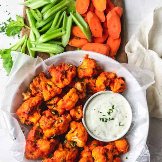 Party platter with Cauliflower Buffalo Bites, carrots and celery