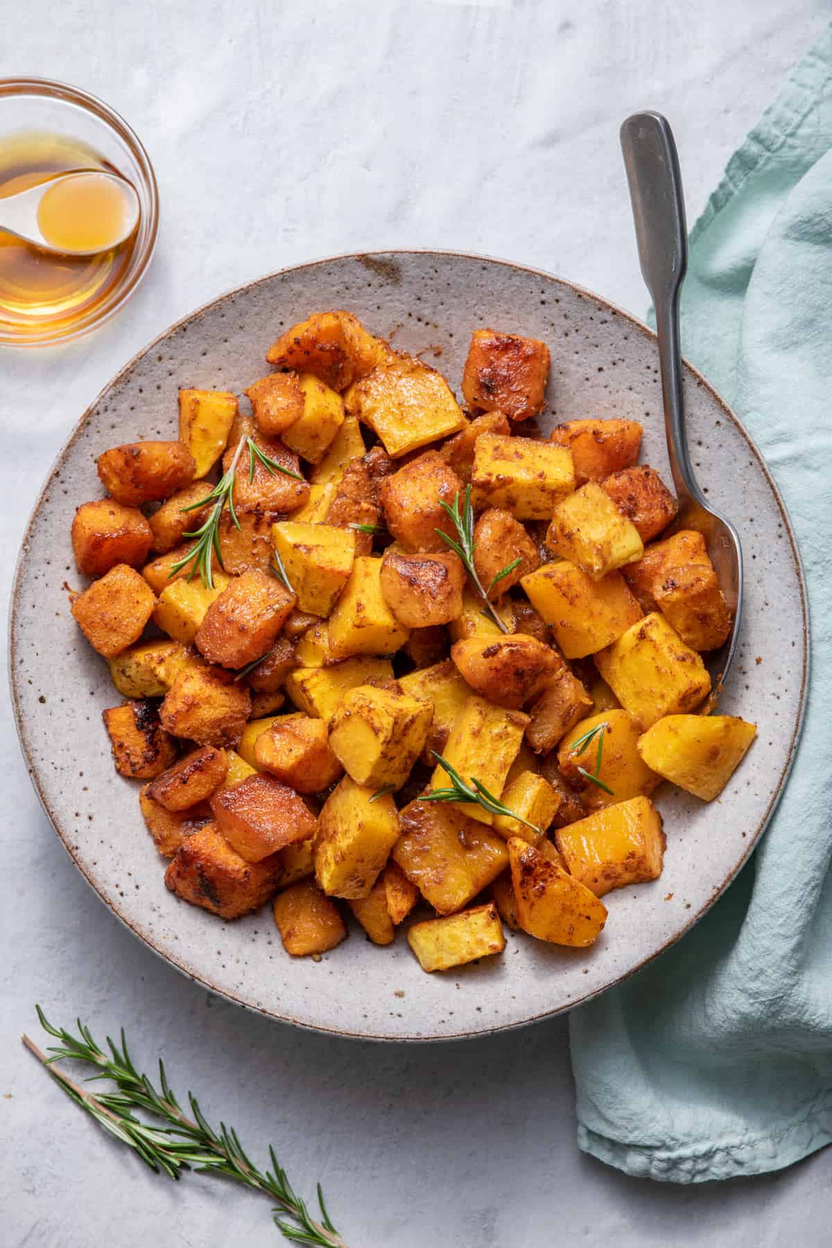 Bowl of cinnamon roasted butternut squash with spoon