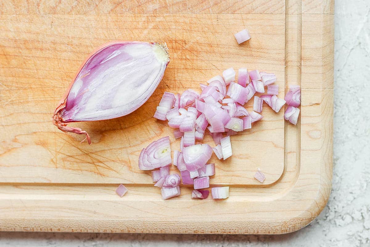 Shallot cut in half and partially diced.