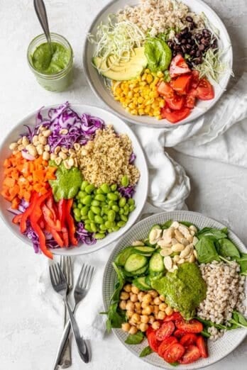 Three grain bowls with toppings