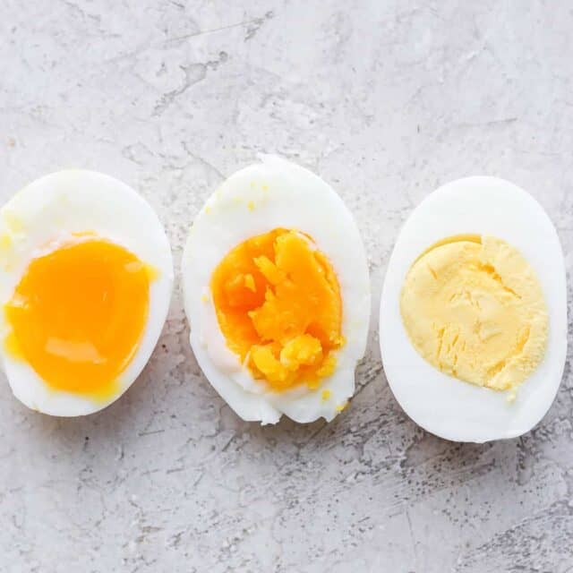 3 boiled eggs, soft, medium and hard - sliced in half to show consistency