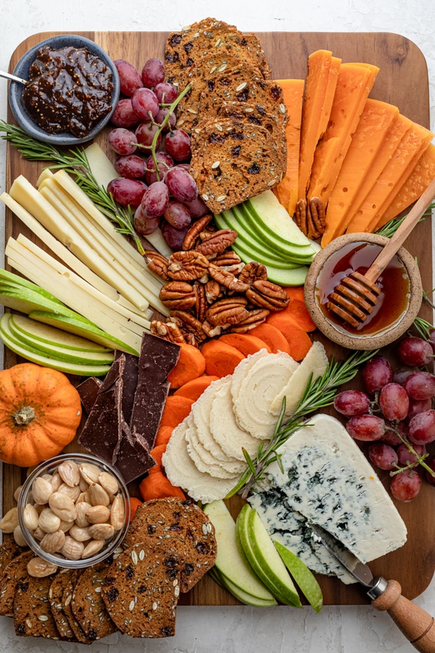 Larger cheese board with more cheese and accompaniments