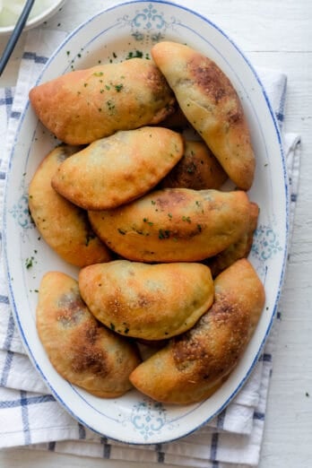 Sfeehas or Lebanese meat pies on a serving dish