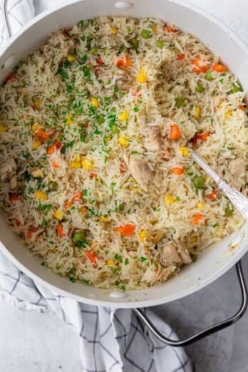 One pot chicken and rice is in a large pot