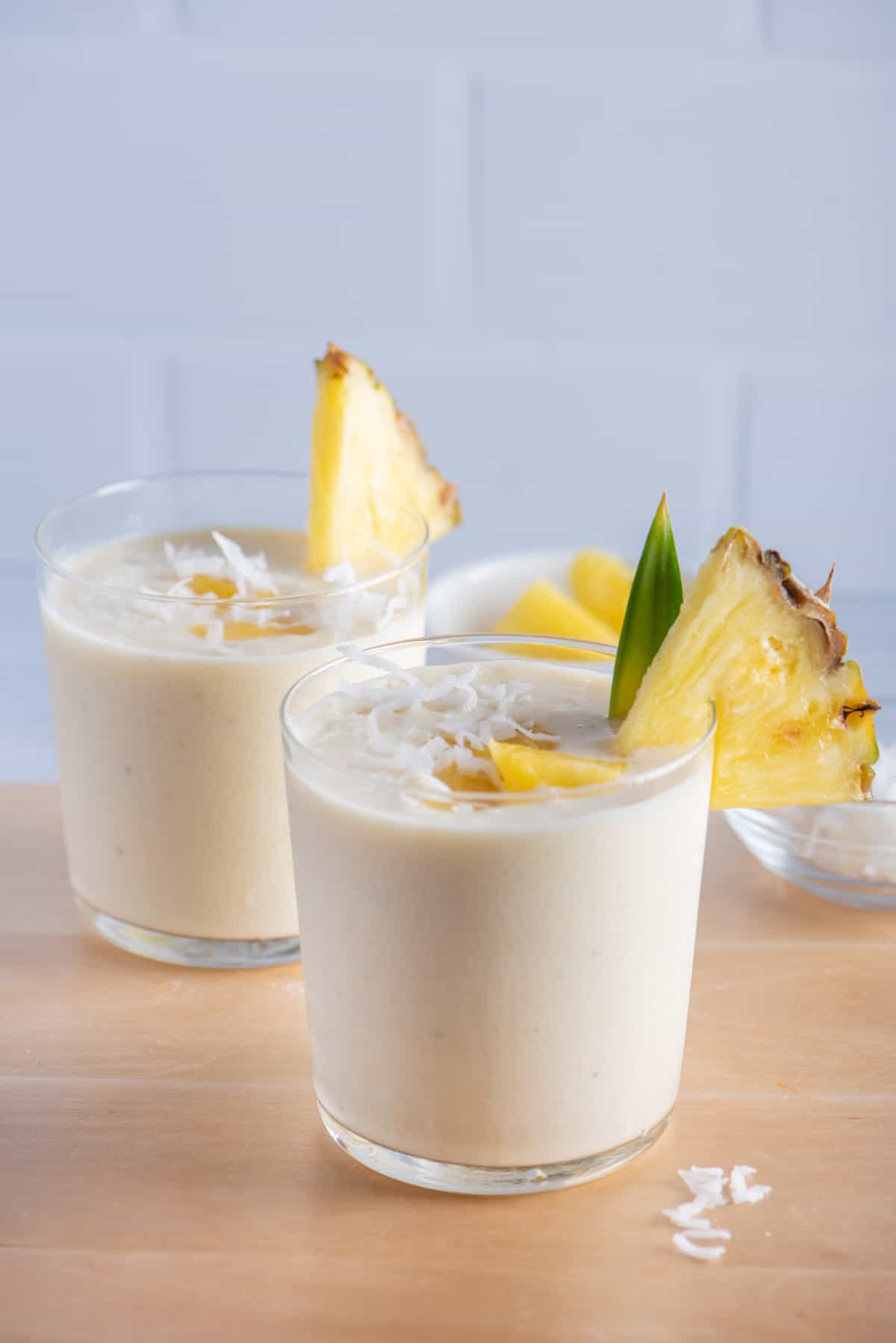 Two cups of pina colada smoothies