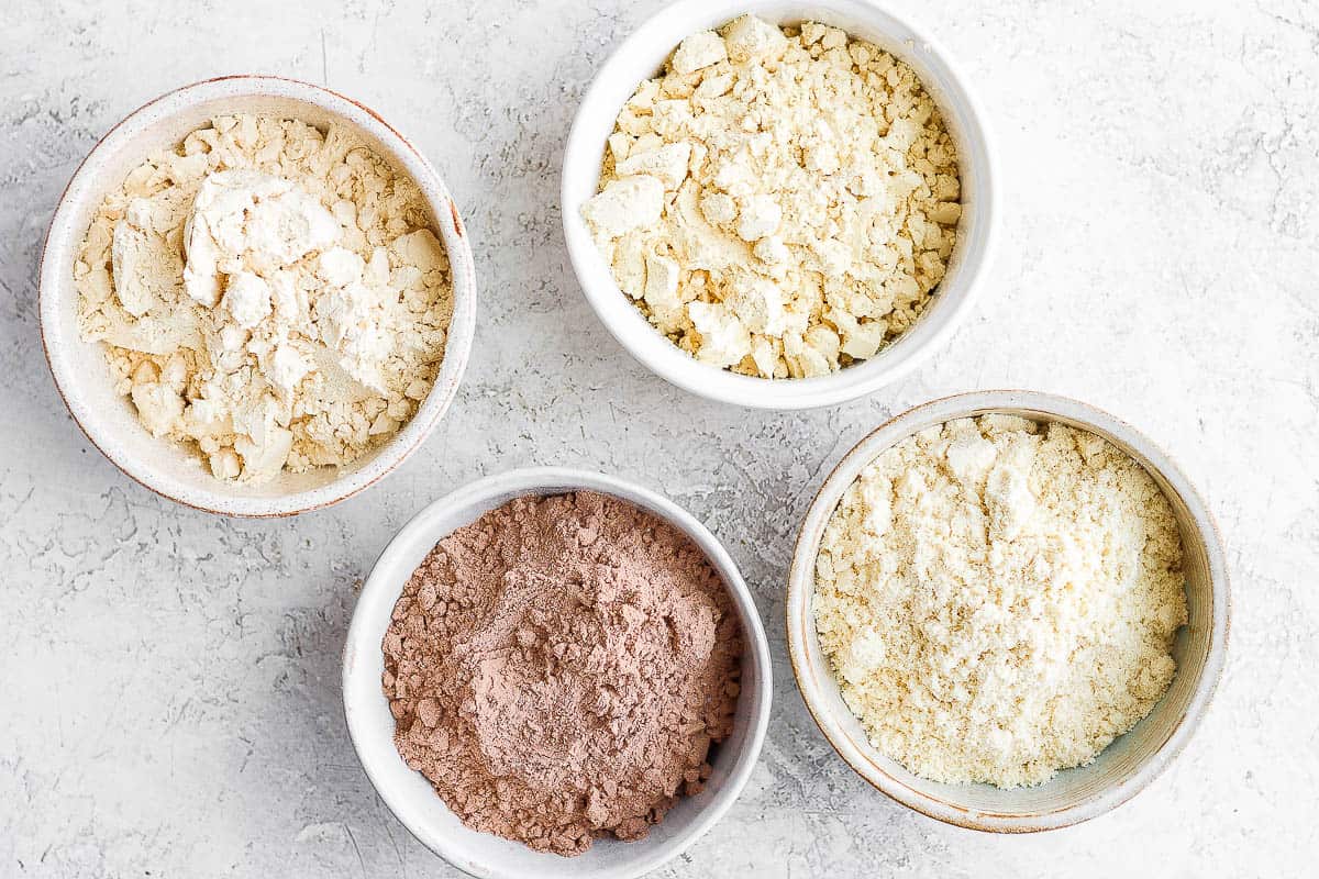 4 types of protein powders in bowls