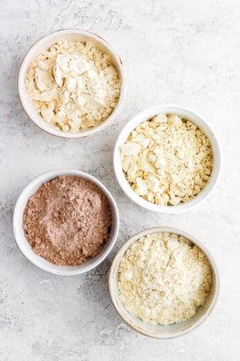 4 types of protein powders in bowls