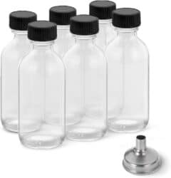 6 pack of small 2 ounce shot bottles with black caps.