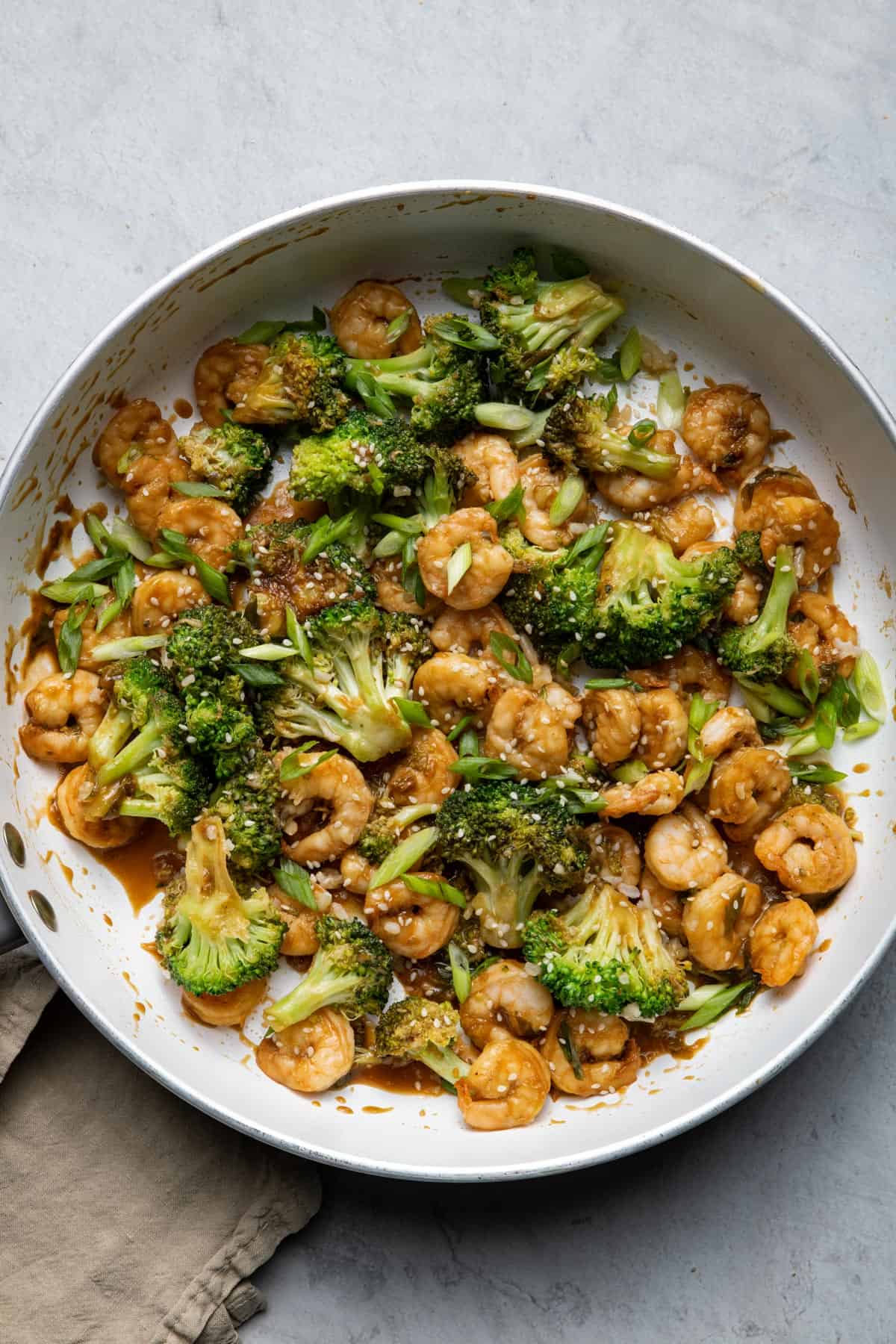 Large pan of shrimp and broccoli stir fry