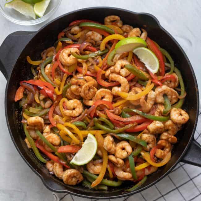 Shrimp Fajitas with Bell Peppers and Avocado Salsa is quick/easy weeknight meal you can whip up in one cast iron skillet